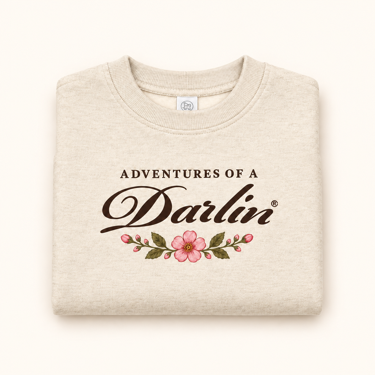 Folded Adventures of a DARLIN® cream kids crewneck with vintage floral artwork