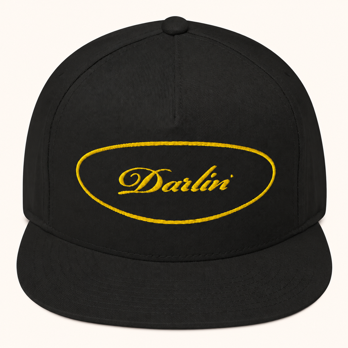DARLIN® Gold Oval Snapback Hat in black with gold script embroidery – front view
