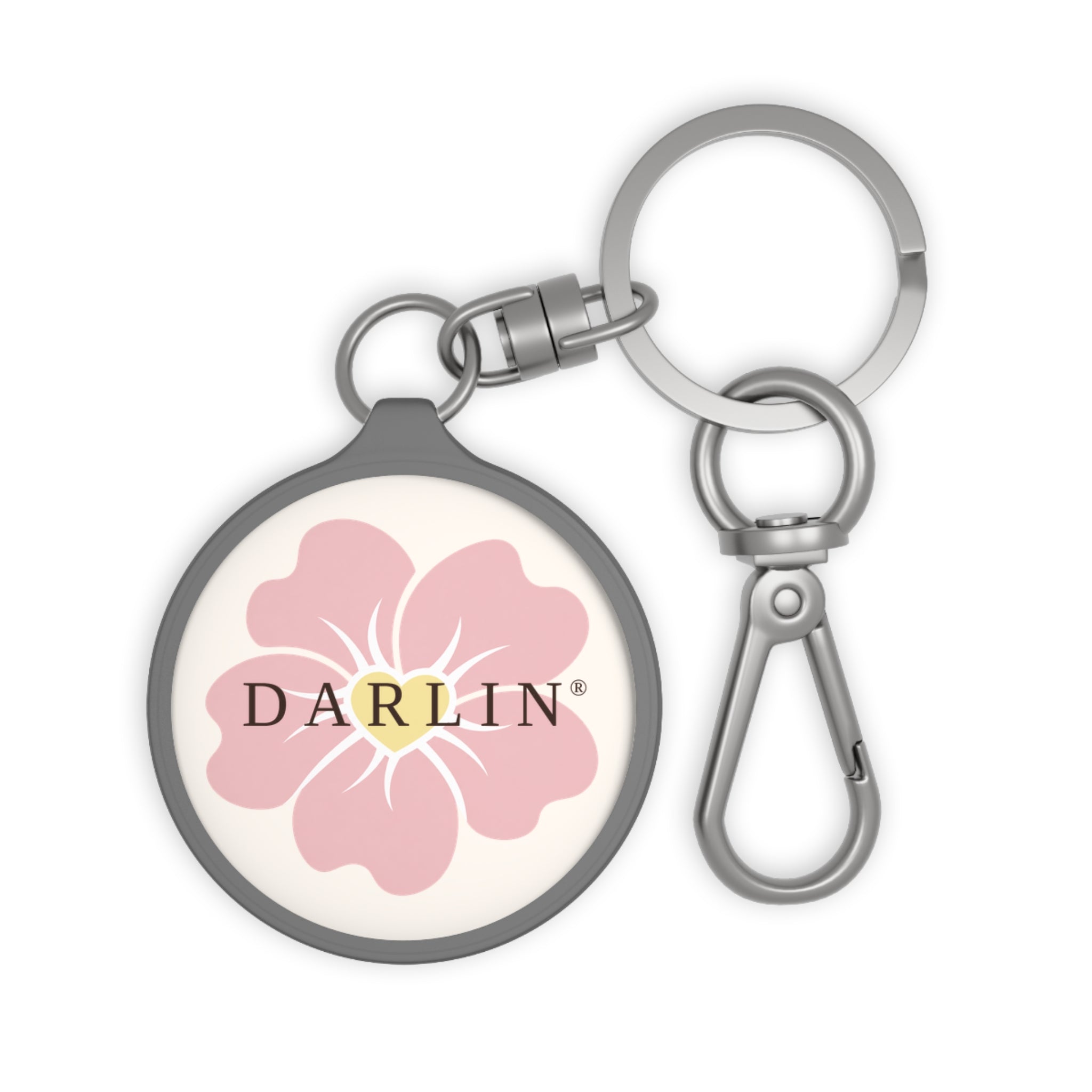 DARLIN® Primrose Keychain with pink primrose flower, yellow heart center and chocolate DARLIN® wordmark.