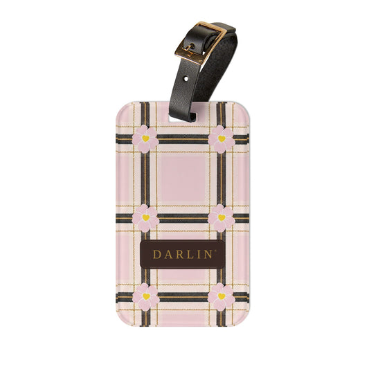 DARLIN® Primrose Plaid luggage tag with pink and cream plaid, primrose flowers and chocolate-and-gold DARLIN® emblem
