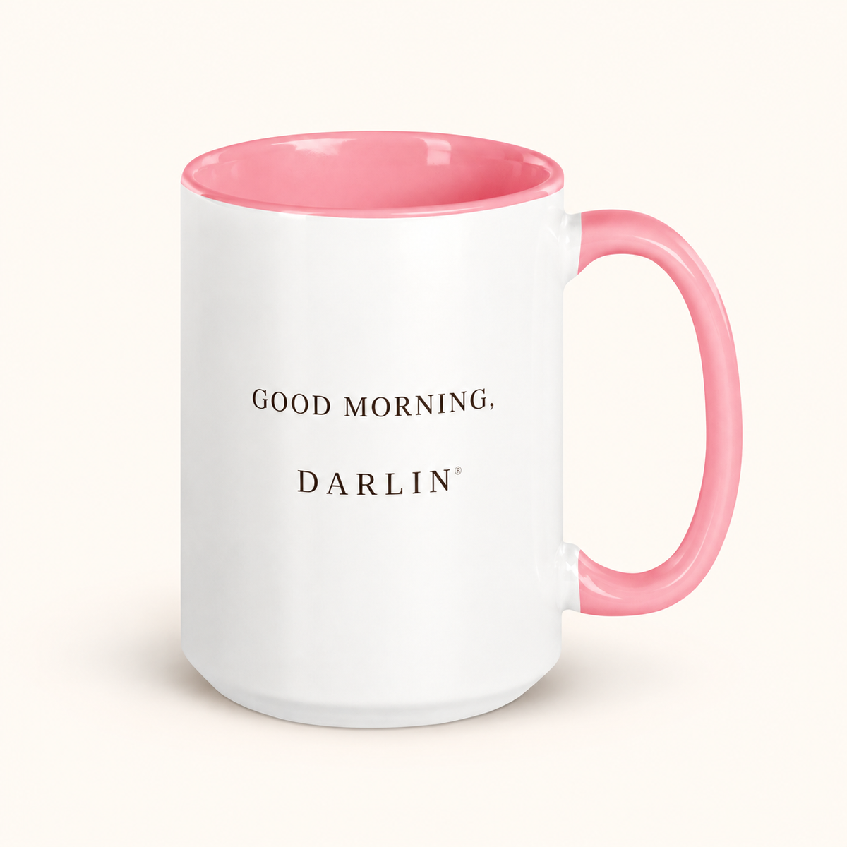 GOOD MORNING, DARLIN® 15 oz ceramic mug with pink interior and handle on a warm ivory background.