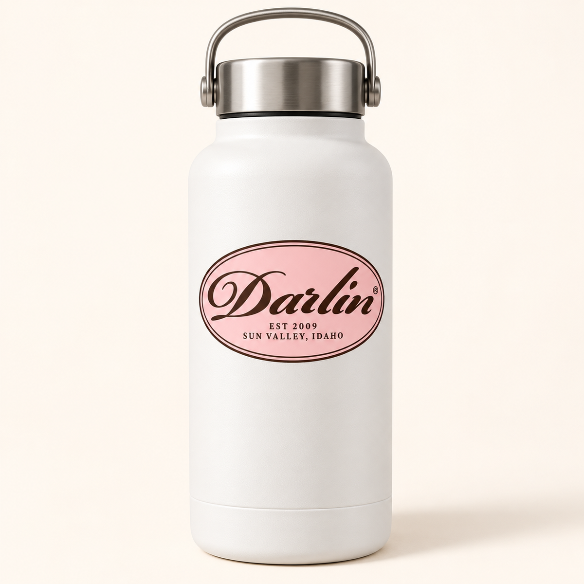 DARLIN® Chocolate Heritage Oval sticker displayed on a white stainless steel water bottle against a warm ivory background.