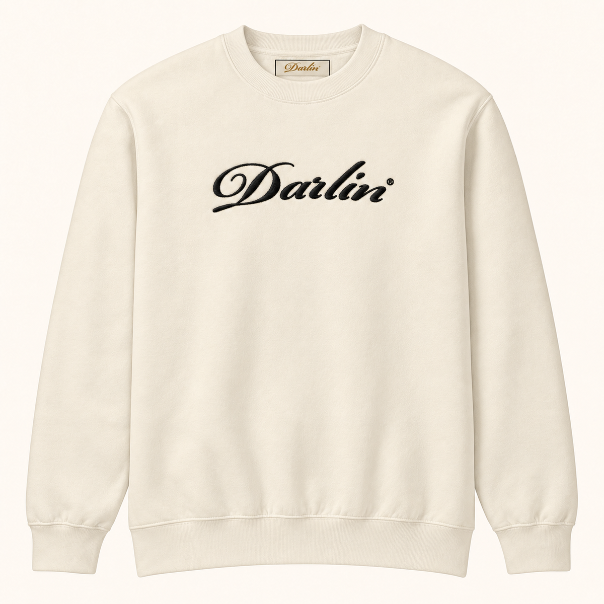 Cream DARLIN® crewneck sweatshirt with black embroidered script logo, front view